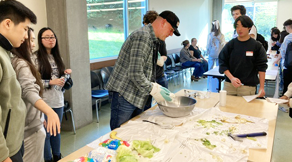 Chemistry faculty demonstrate some of the properties of freezing during an Exploring Pathways event.