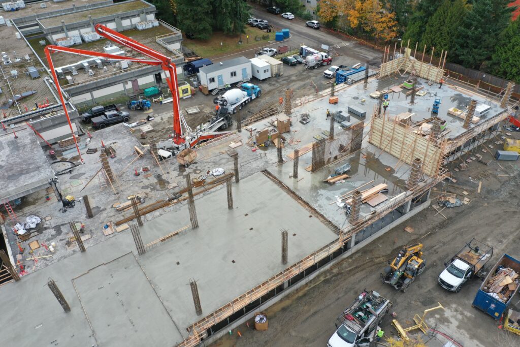 Large crane in aerial shot of W Building construction.