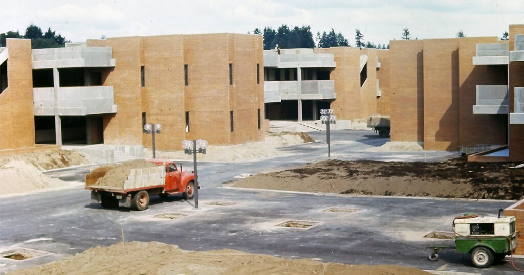 Construction truck drives on the Bellevue College campus as its being built.