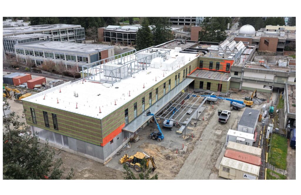 W building begins to take shape with walls constructed.
