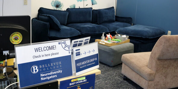 Neurodiversity Navigators office space with computer, couch and chair.