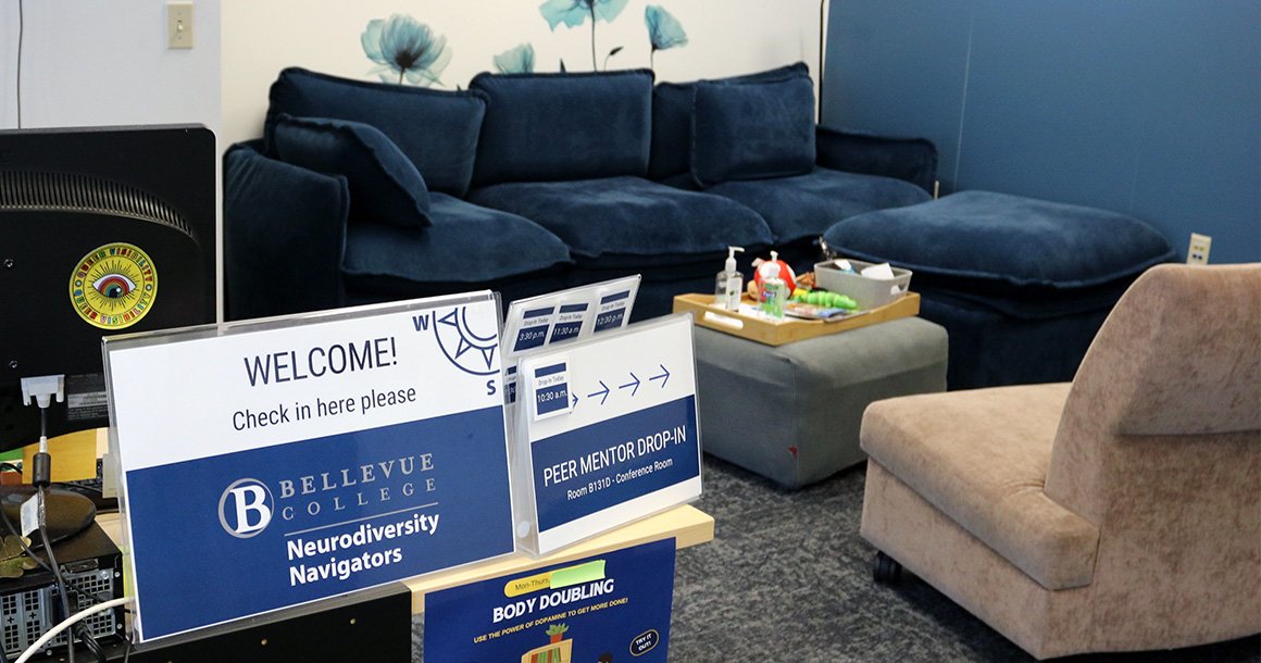 Neurodiversity Navigators office space with computer, couch and chair.