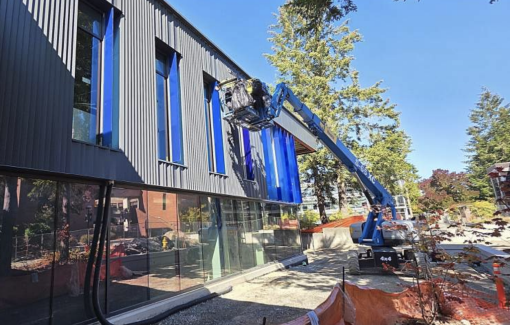 A side view of the W Building showcasing the BC blue window frames