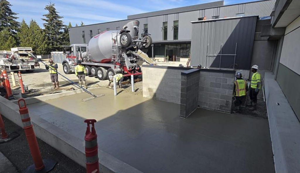 concrete being poured just outside the W building