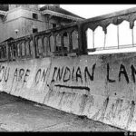 Photo of graffiti that reads "You are on Indian land"