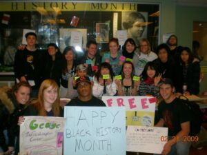 students lined up with signs