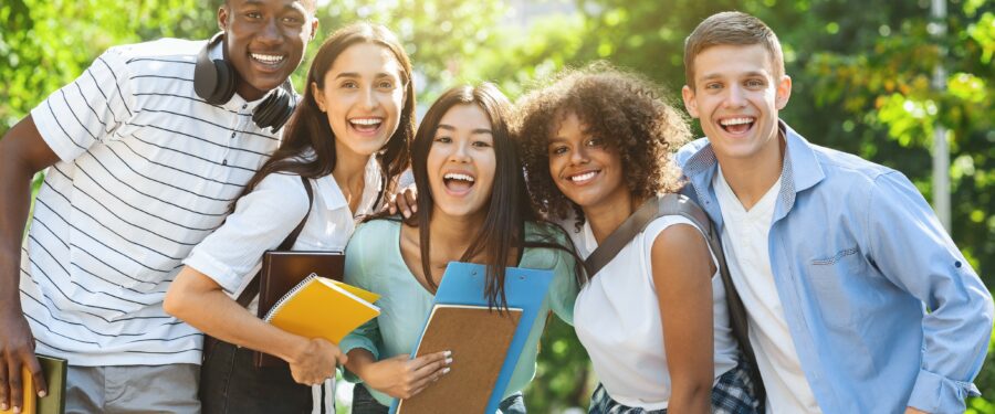 Group of diverse students standing outside