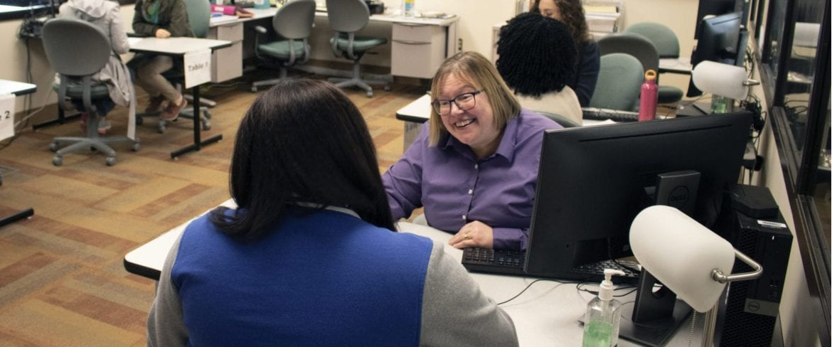 Lab Tutor working with student