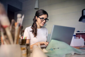 Woman using her laptop representing online learning