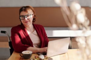 Woman working online representing online assessment