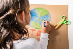 Girl drawing the world