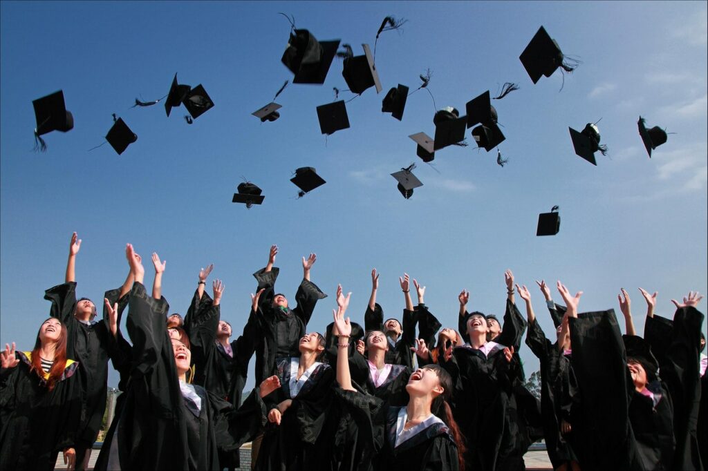 Picture of graduates is decorative only.