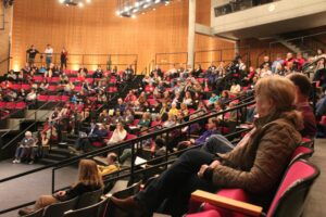 Room full of people seated