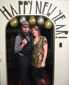 New Years Even Thrifted outfist on couple under balloons