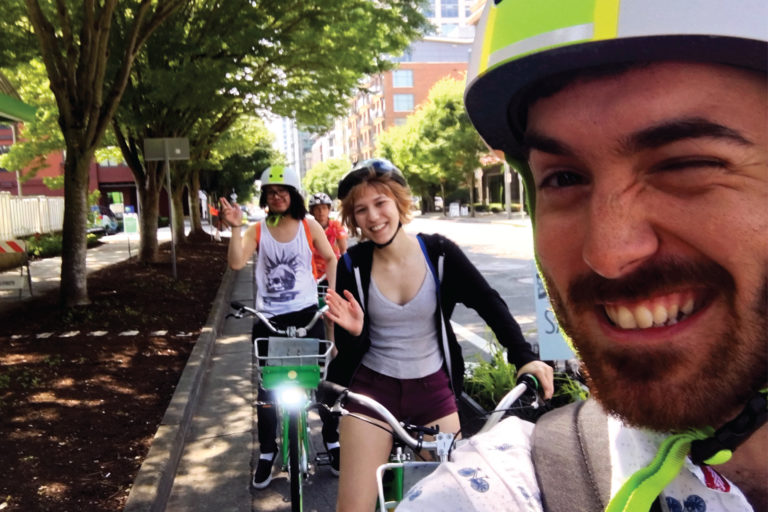 Members of the sustainability team bike riding together.