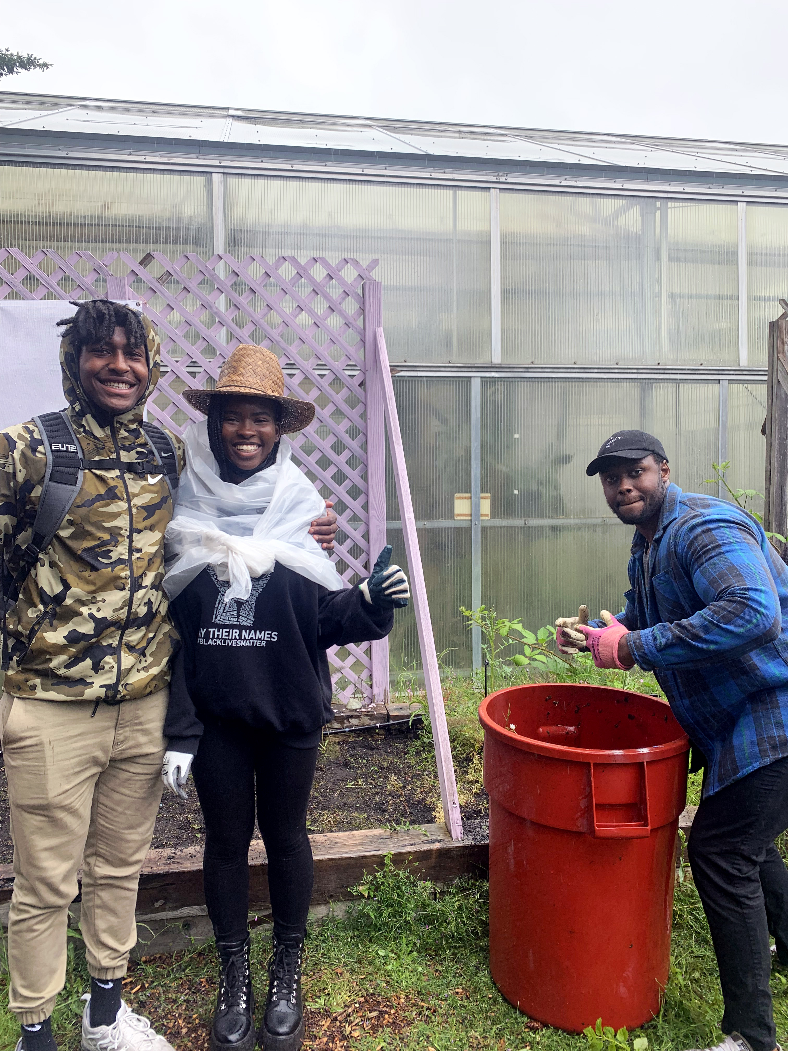 group of students cleaning the garden