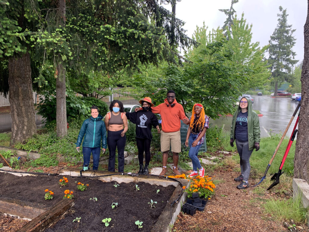 students during a garden club event with plants