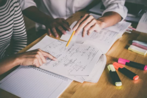 Student and tutor sitting in a table