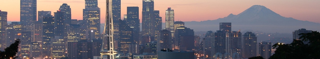 Image of downtown Seattle and Mount Rainier at sunset to indicate community