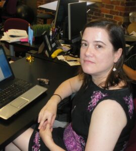 Cara Diaconoff sitting at a desk