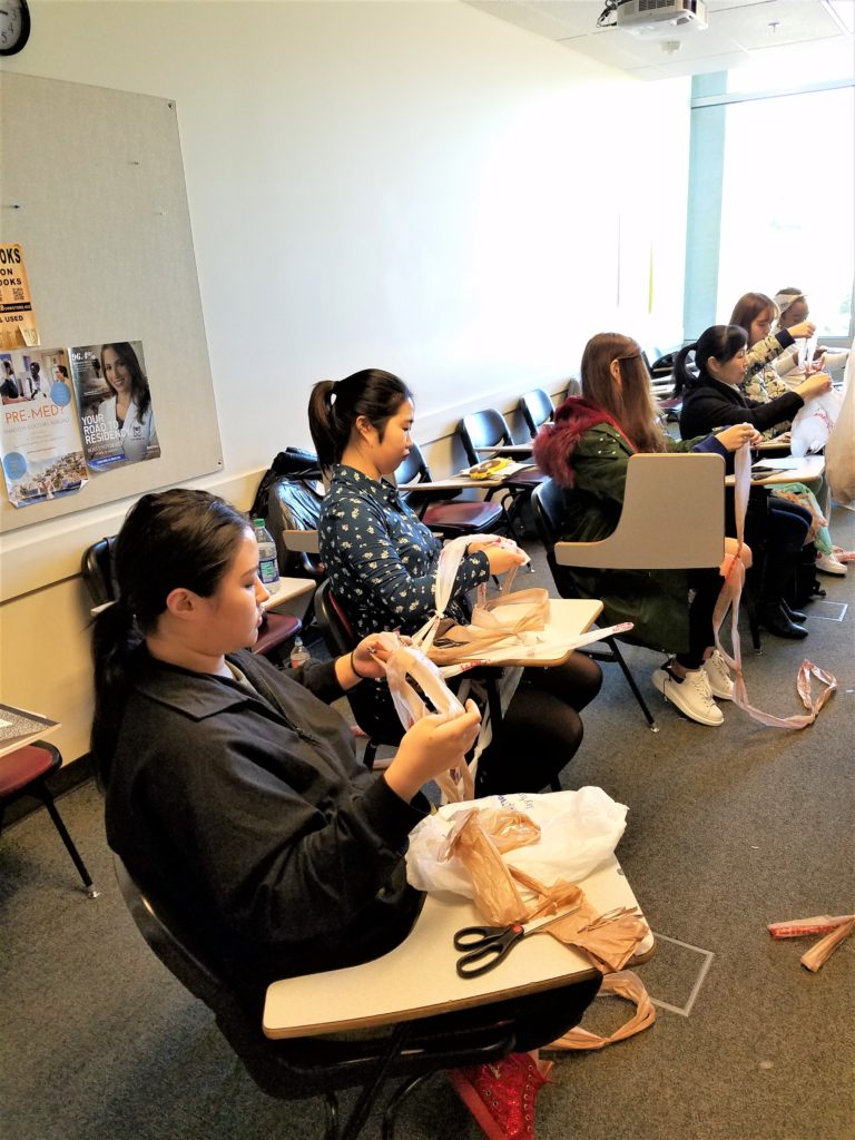 Students working on project in a class