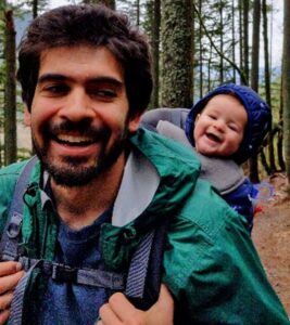 Photo of Nico Quijano in forest with baby