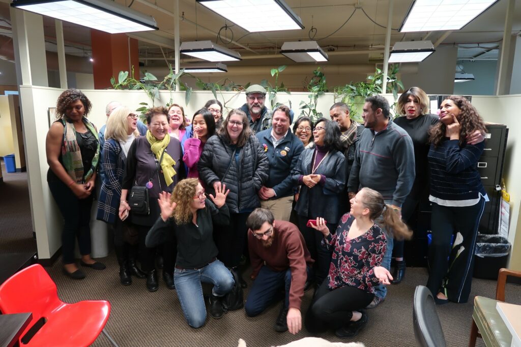 Faculty members huddled in for a picture