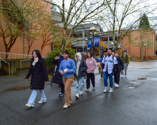 Global leader giving a campus tour to new students