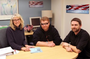 Assisting U.S. Army veteran Thomas McElearney, Jr., are Leslie Strand, assistant financial aid director, and Veterans’ Office assistant Joshua Kienlen