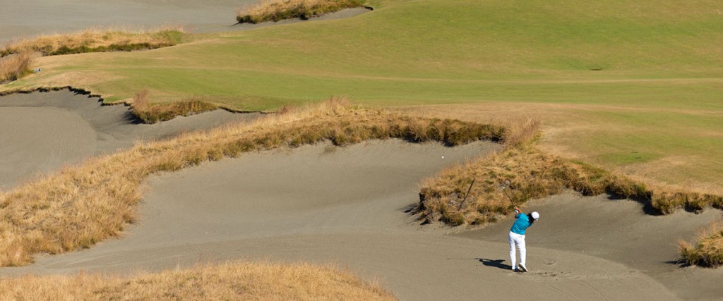 Richard Lee plays his shot from a bunker on the 14th hole during a practice round for the 2015 U.S. Open at Chambers Bay in University Place, Wash. 