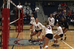 Bellevue College volleyball players get set to return a shot against Edmonds