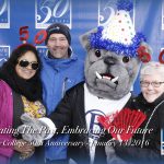 BC mascot Brutus the Bullodg poses with ice skaters