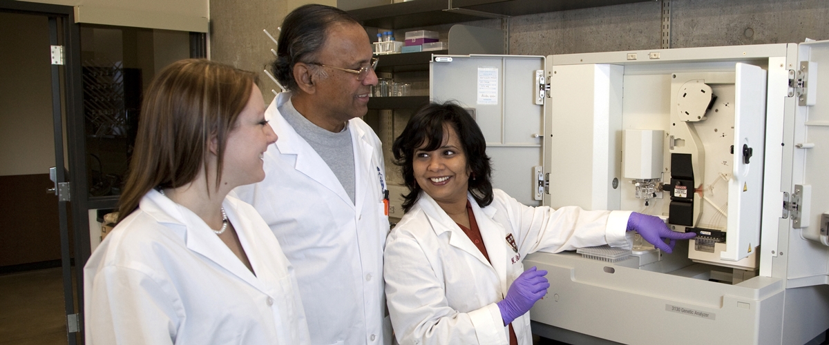 Dr. Rita Bangera (right) works with two students in the science lab