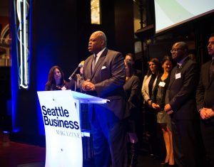 Al Lewis speaking at the Community Impact Award ceremony