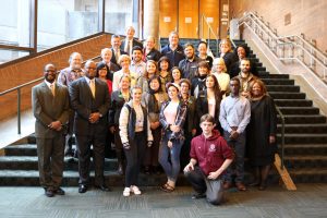 Students, faculty and staff pose with the justices