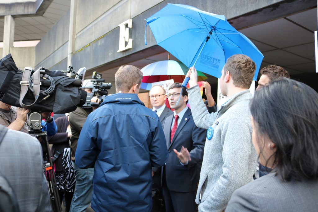 Members of the press interview Washington Attorney General Bob Ferguson