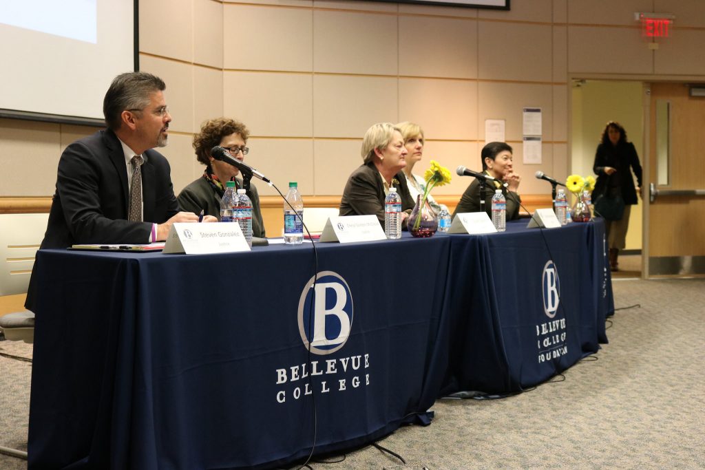 The WA State Supreme Court justices listen to questions at the Open Forum