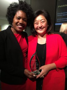 Sonja Green and Yuko Kodama hold the award.