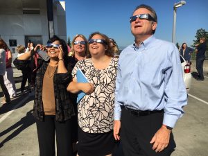 Dr. Weber, faculty & staff observing the eclipse