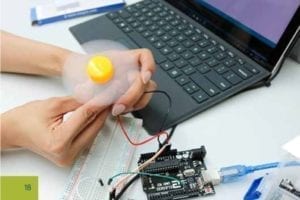 The hands of a student working on a project