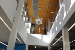 Two students standing on a balcony