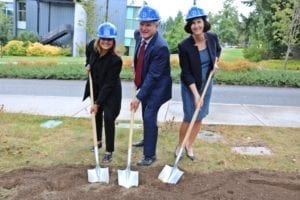 3 people digging with shovels