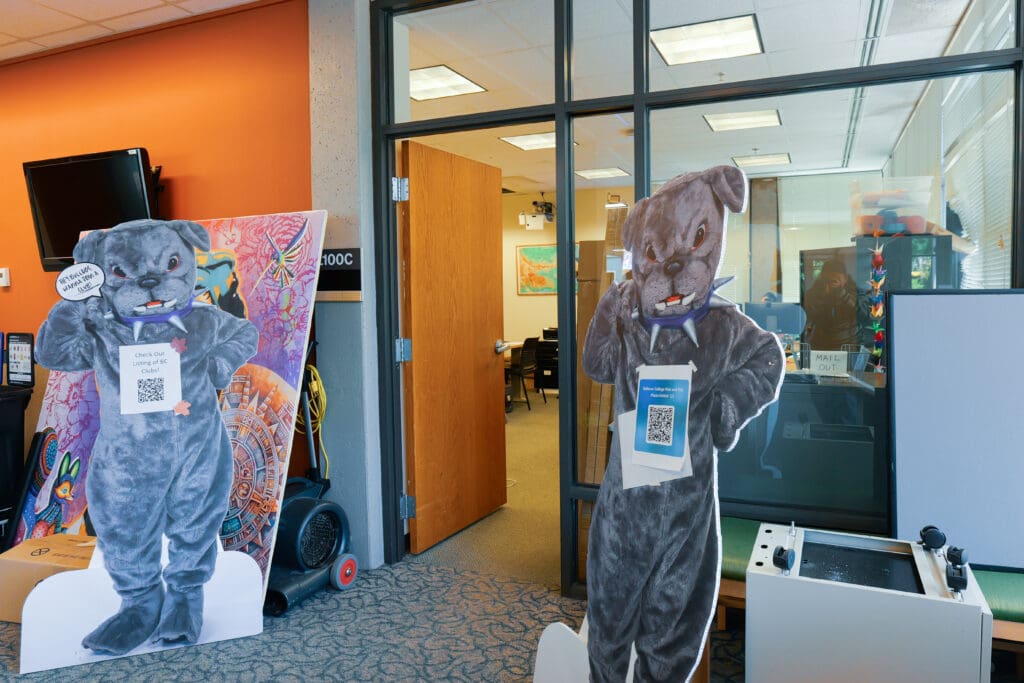 Doorway to L100C with doorway flanked by Brutus cutouts inviting students to check out our club listing