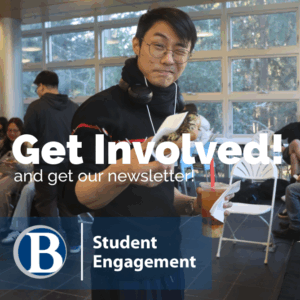 Student at Karaoke Destress event holding up his free hot lunch with a quirky "you got it!" expression.