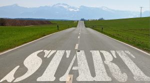 The word Start written on a road leading off into the distance