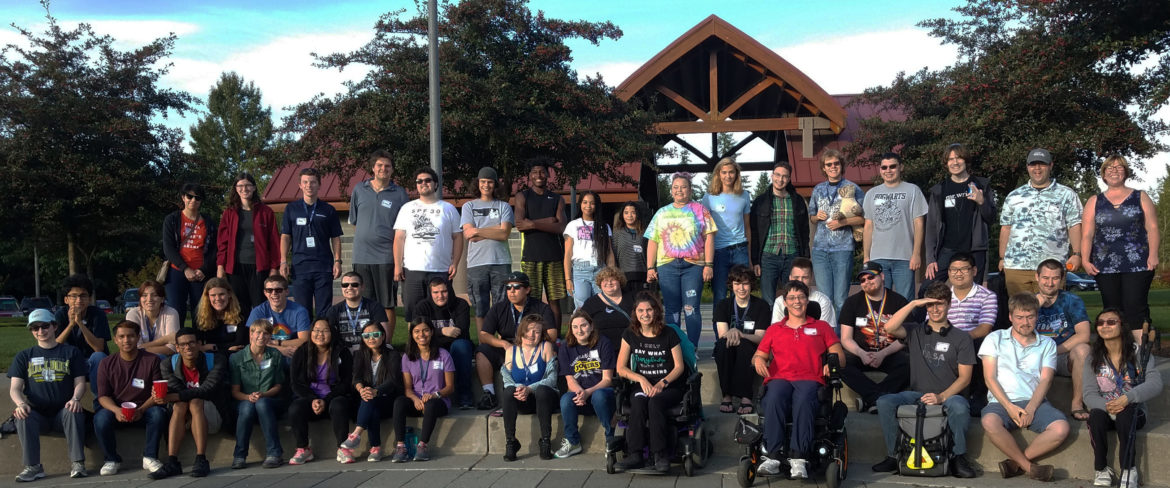 large group of young adults in a park