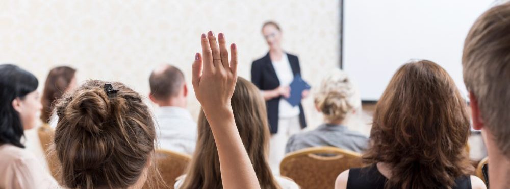 Stock image of audience viewing a presentation