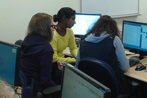 OLS Students working together at a computer