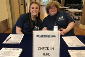 OLS Students sitting at College Bound Check-in desk