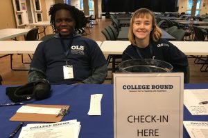 OLS Students sitting at College Bound Check-in desk